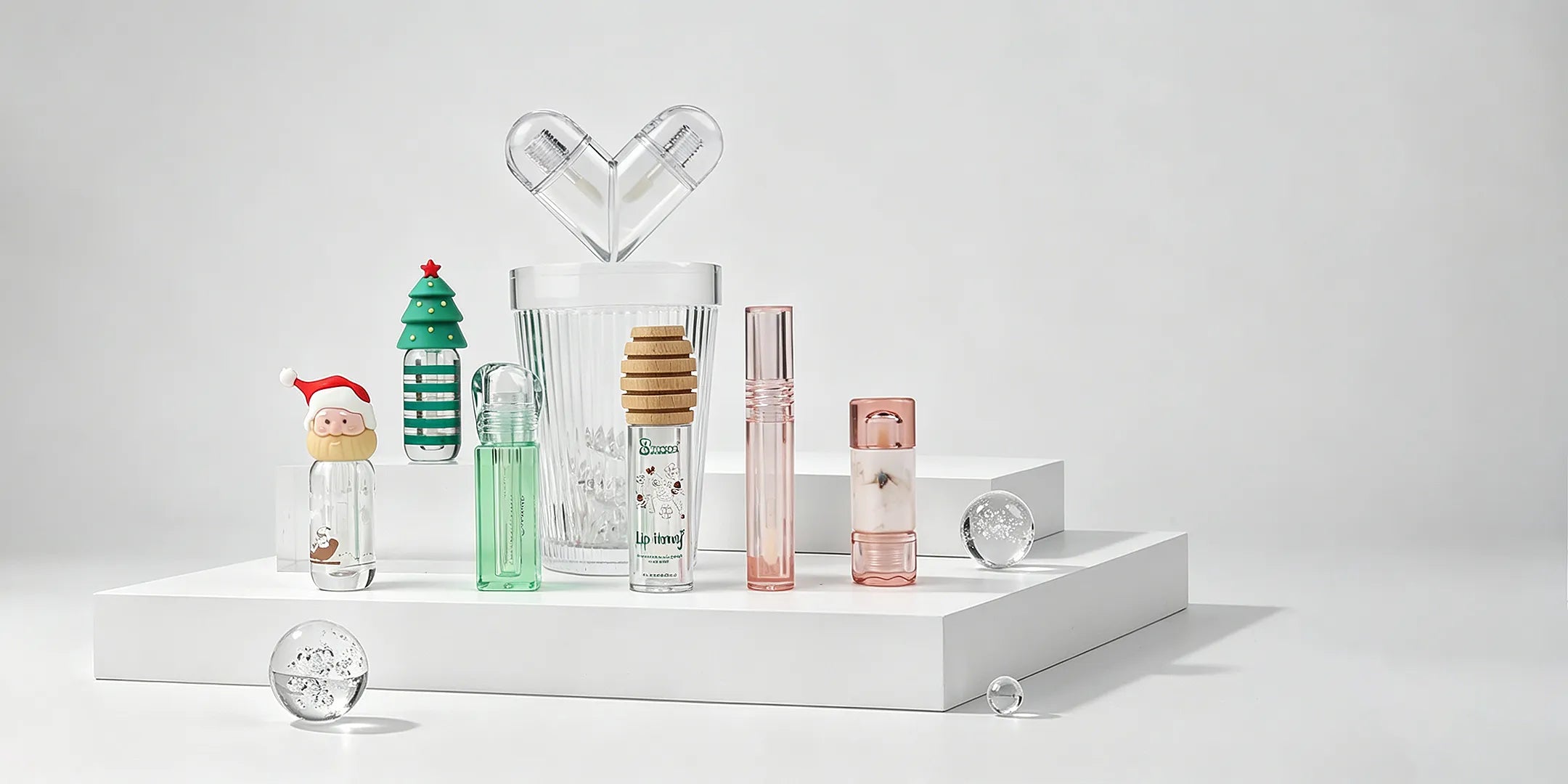 Kaiya clear lip gloss tube set with transparent bottles and custom cap options for lip gloss packaging.
