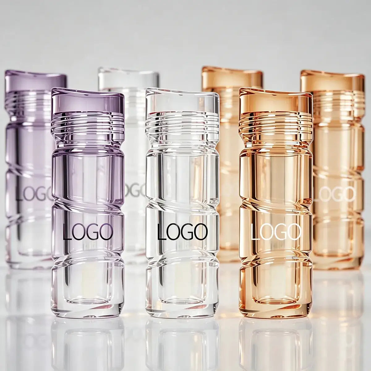 Custom lip gloss bottles in clear, purple and metallic color options for beauty brands