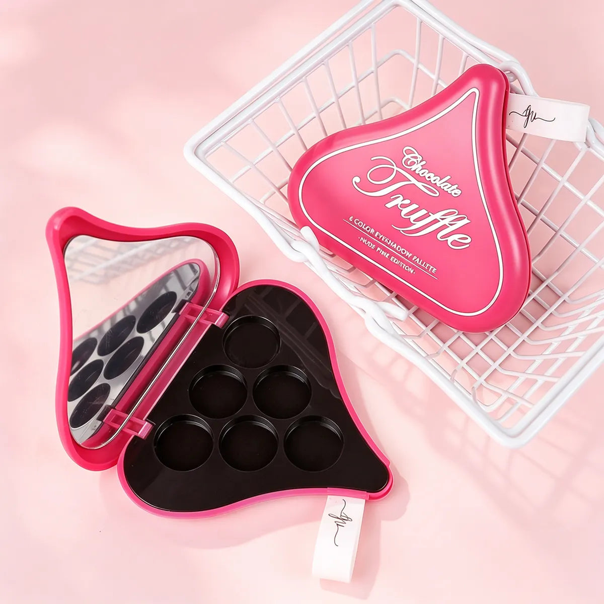 Cute eyeshadow palette packaging in a pink playful shape with mirror and multi-pan design for cosmetic brands.