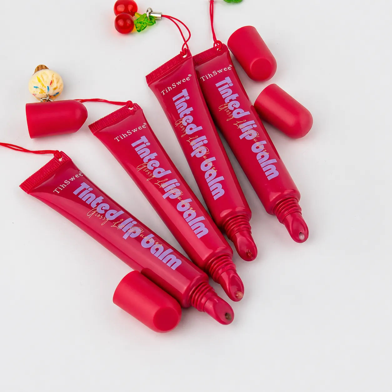 Kaiya 10ml lip gloss squeeze tubes in red soft tube packaging with applicator tips