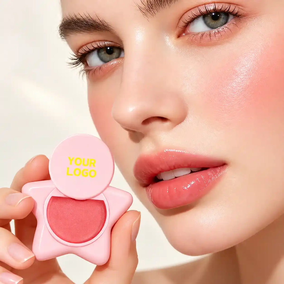 Model holding a pink blush compact, showcasing private label blush development by KAIYA for beauty brands seeking beauty product manufacturers.