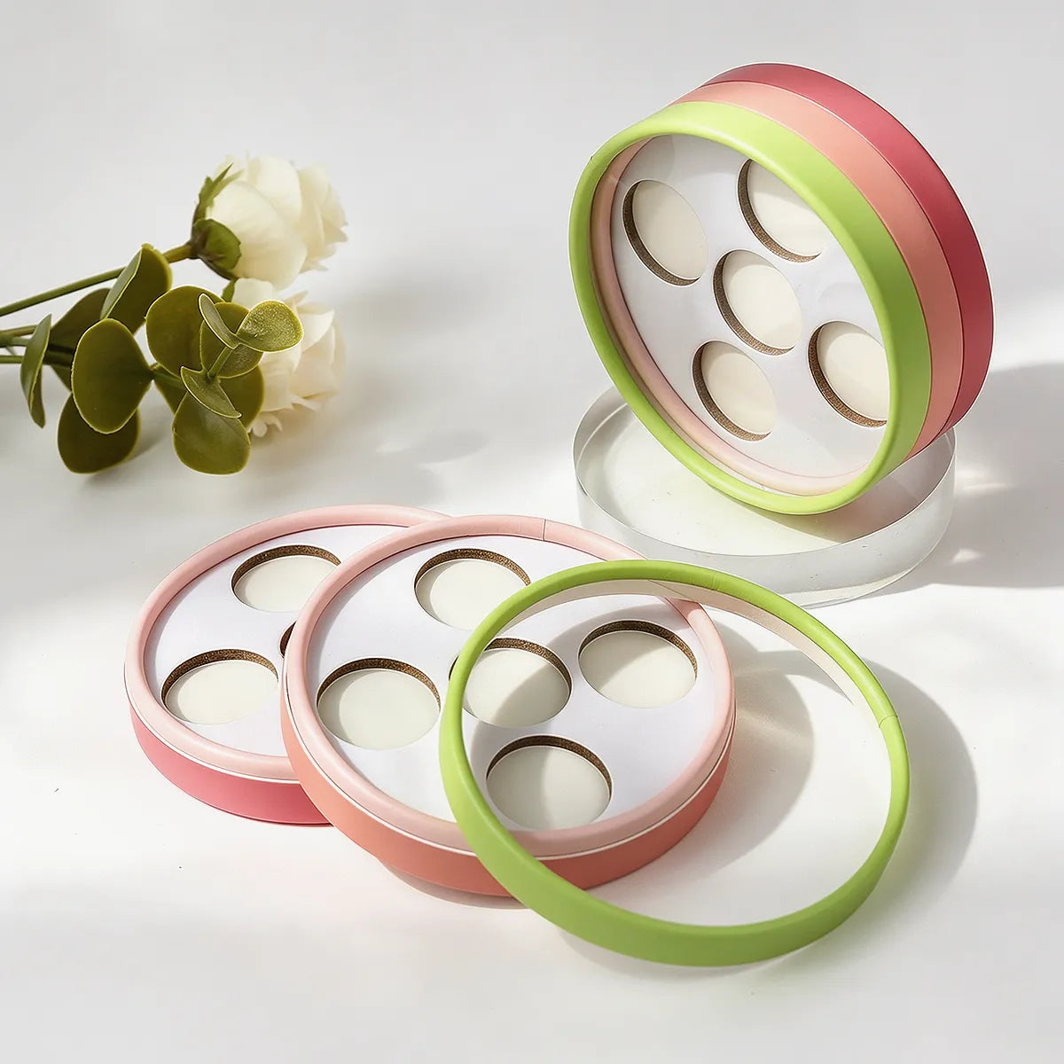 Kaiya cardboard eyeshadow packaging with round palette design and multiple pan layout for custom eye makeup projects.