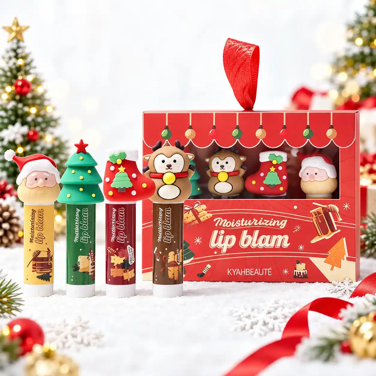 Christmas lip balm tubes with character caps displayed beside a red window gift box with a ribbon handle.