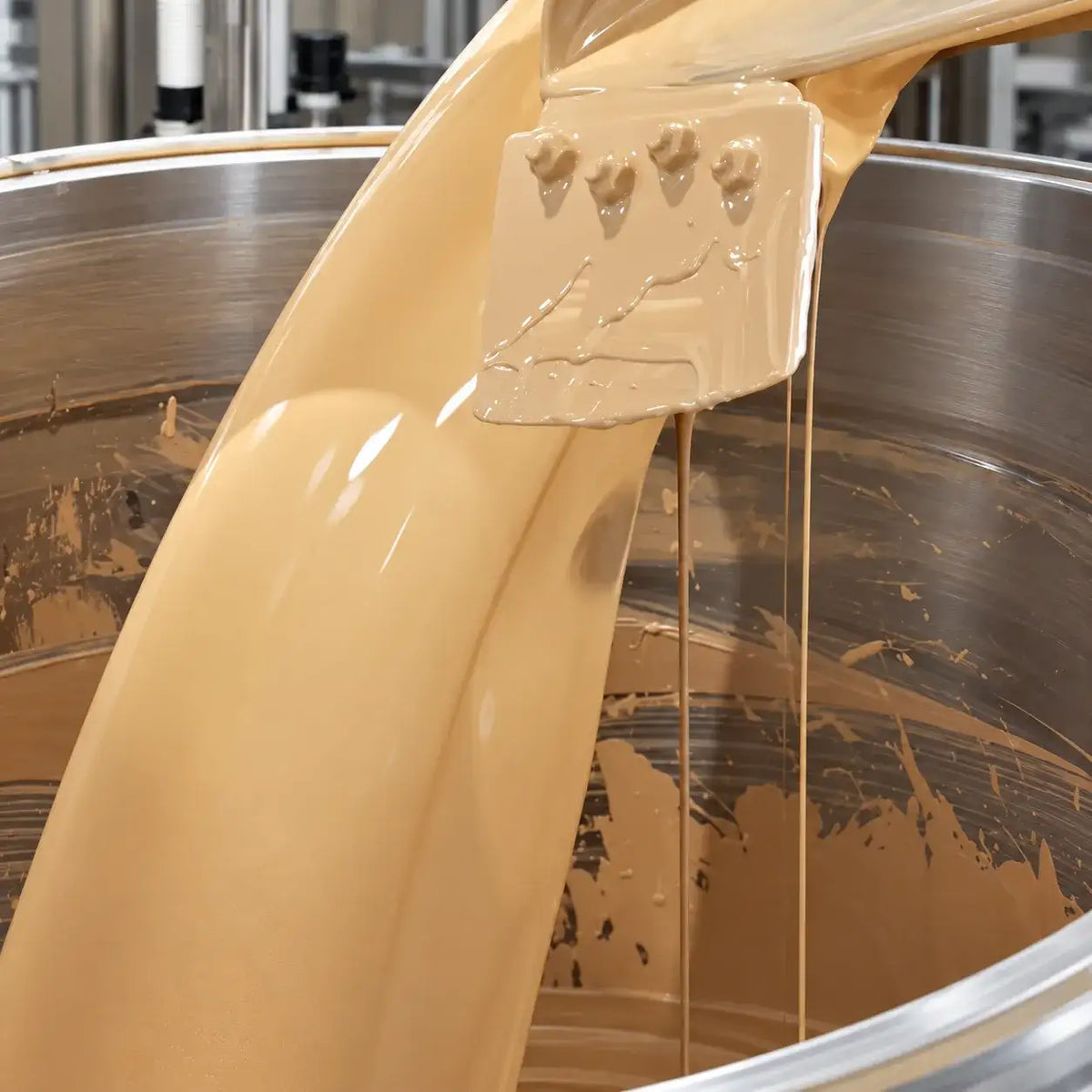 Concealer OEM production process showing creamy beige makeup formula being mixed in a manufacturing vessel at KAIYA.