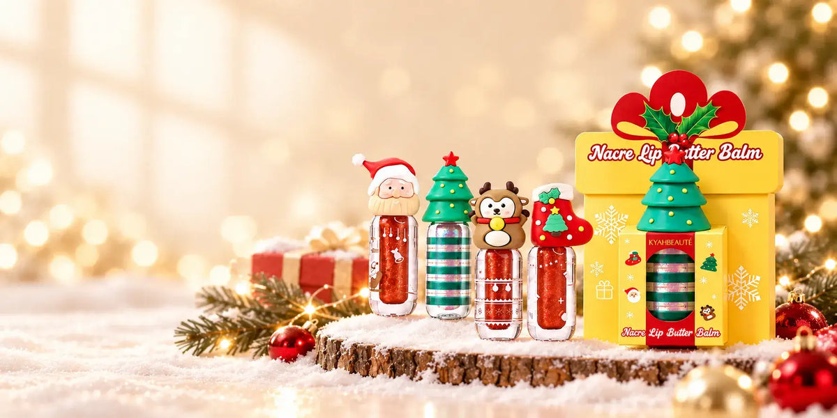 Christmas shimmer lip gloss with Santa, tree, reindeer and stocking caps beside a yellow gift box.