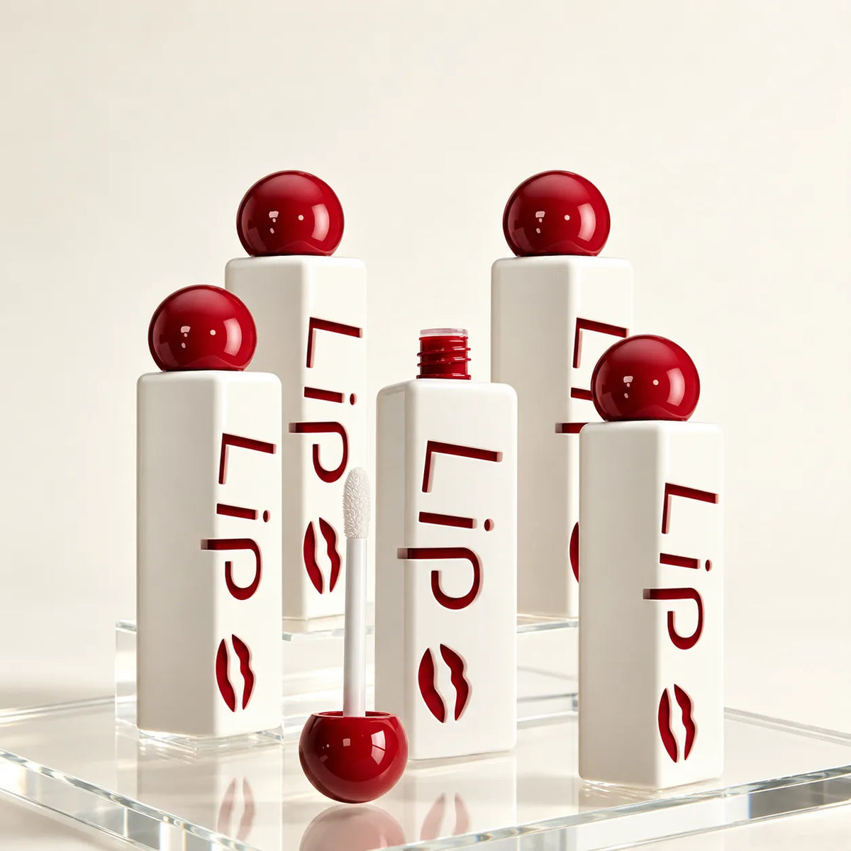 Kaiya custom lip gloss tubes with burgundy ball caps and molded lettering on white outer bodies