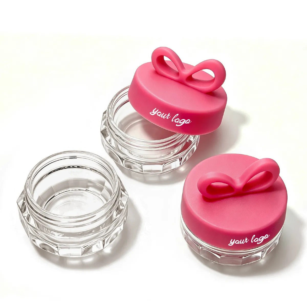 Empty lip balm pots with clear round bodies and bow-shaped caps for custom mini balm containers by KAIYA