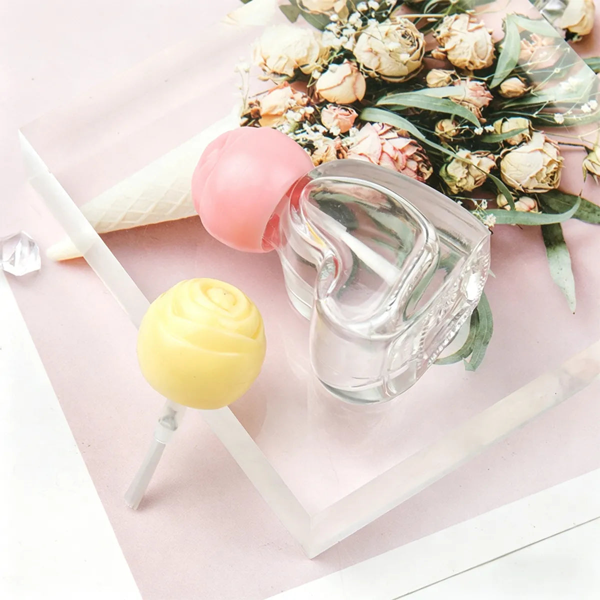 Empty plastic nail polish bottles in heart and lollipop design by Kaiya