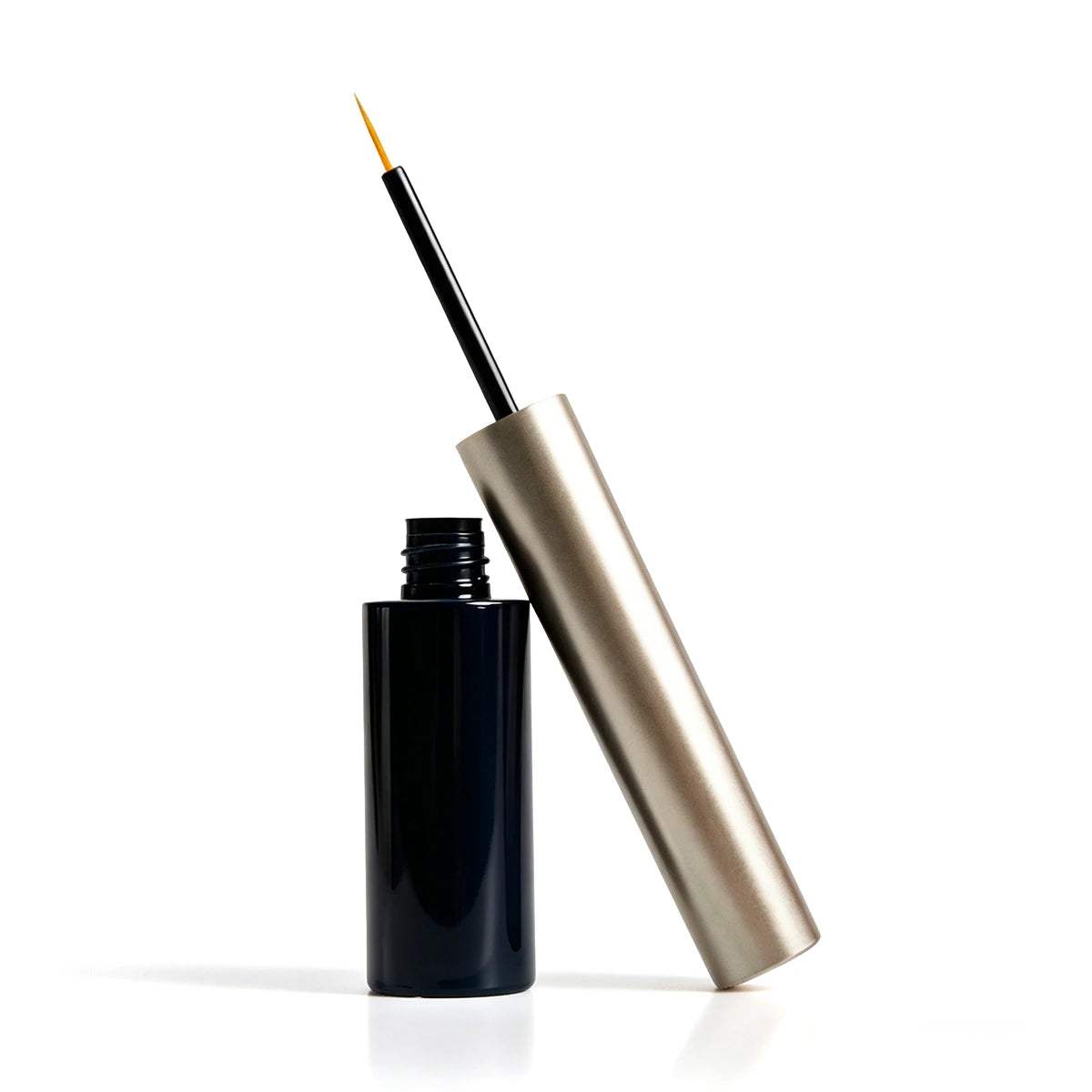 Black and gold **eyeliner bottle** with slim brush applicator, suitable for custom liquid eyeliner packaging and luxury eye makeup bottle projects.