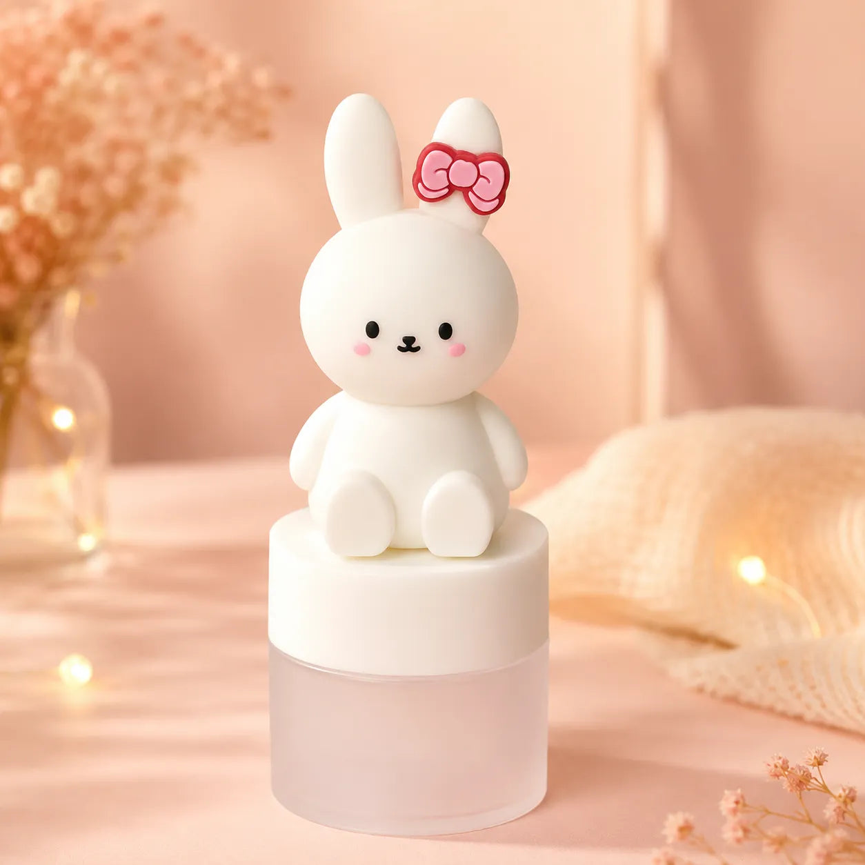 Lip balm container by KAIYA featuring a cute bunny design in a soft pastel display.