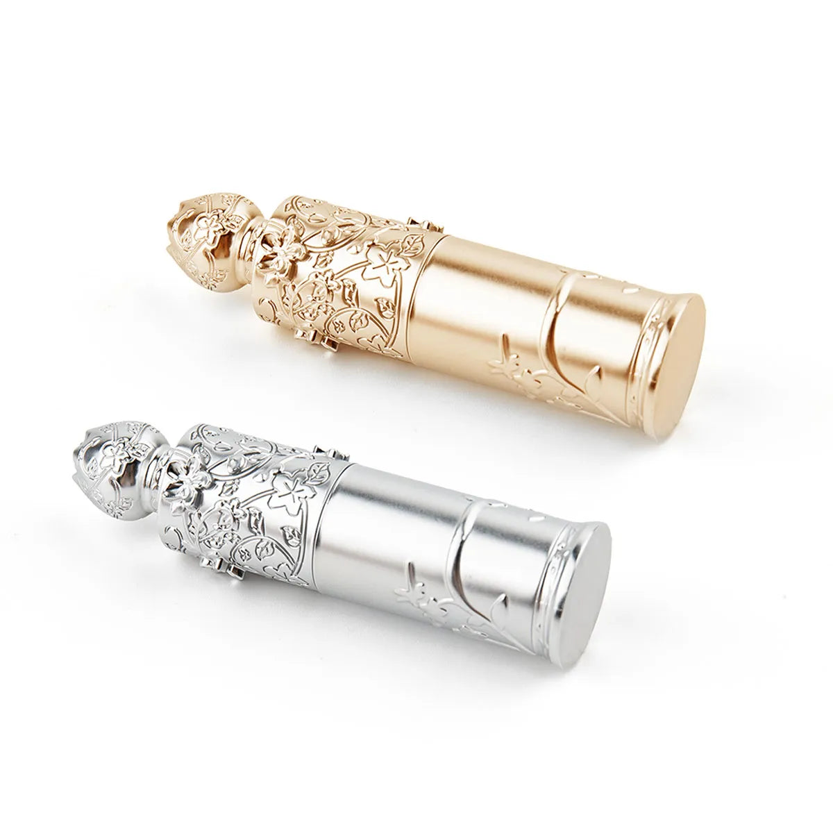 Lip balm containers by KAIYA, featuring gold and silver decorative balm tube packaging with embossed floral details.