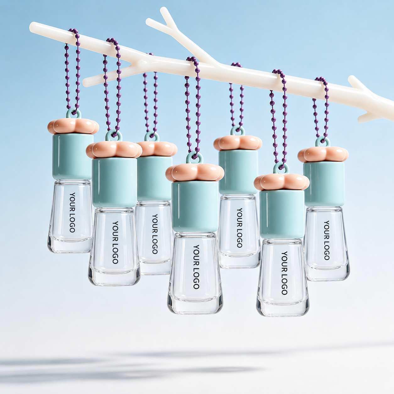 Lip gloss containers by KAIYA, featuring empty lip gloss keychain packaging with blue case design, heart-shaped pink applicators, and clean empty brush tips.