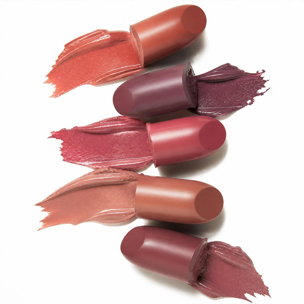 Four lipstick bullets with matching color swatches from KAIYA, a lipstick formulation manufacturer.