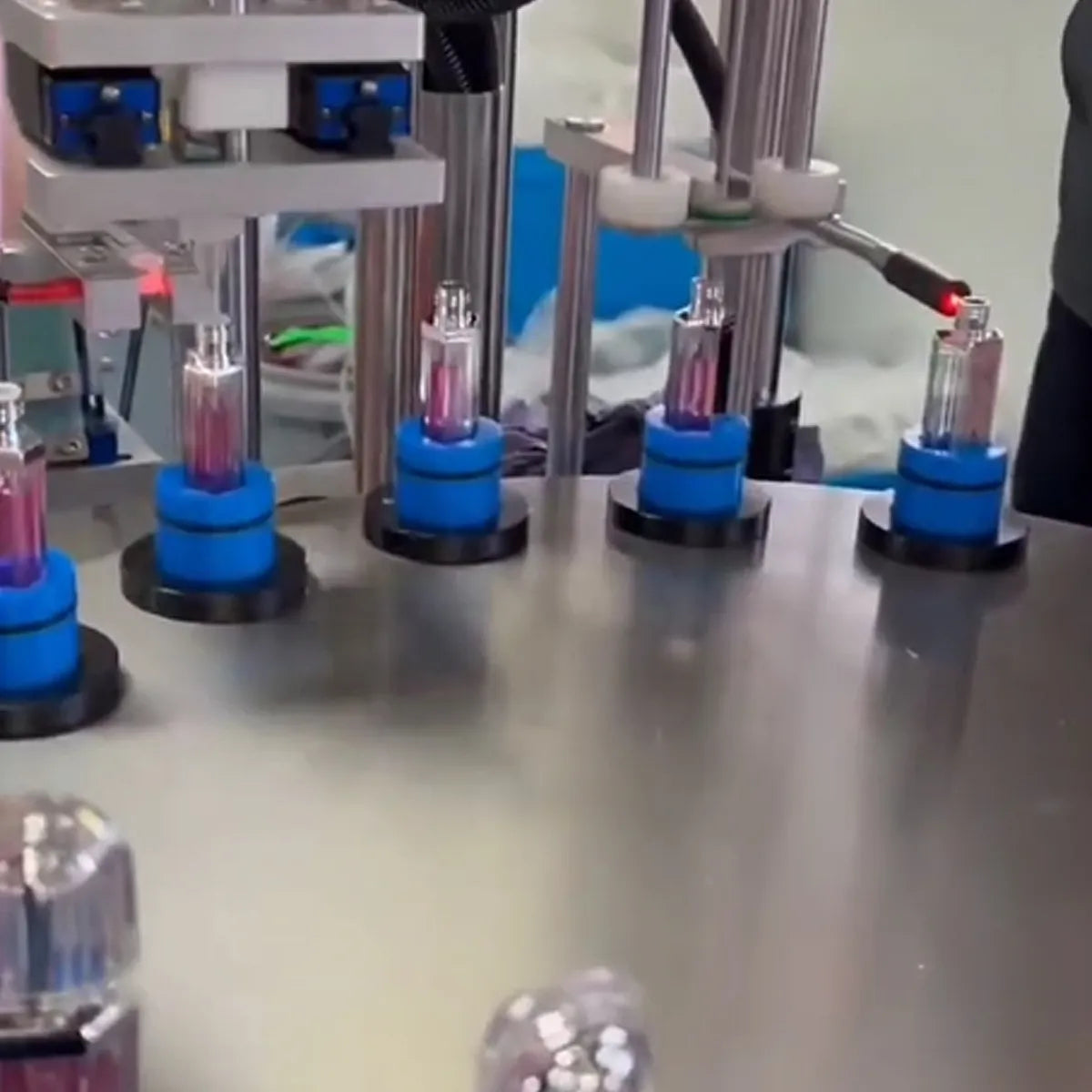 Makeup manufacturer KAIYA showing tube filling equipment for finished color makeup production and bulk makeup orders.