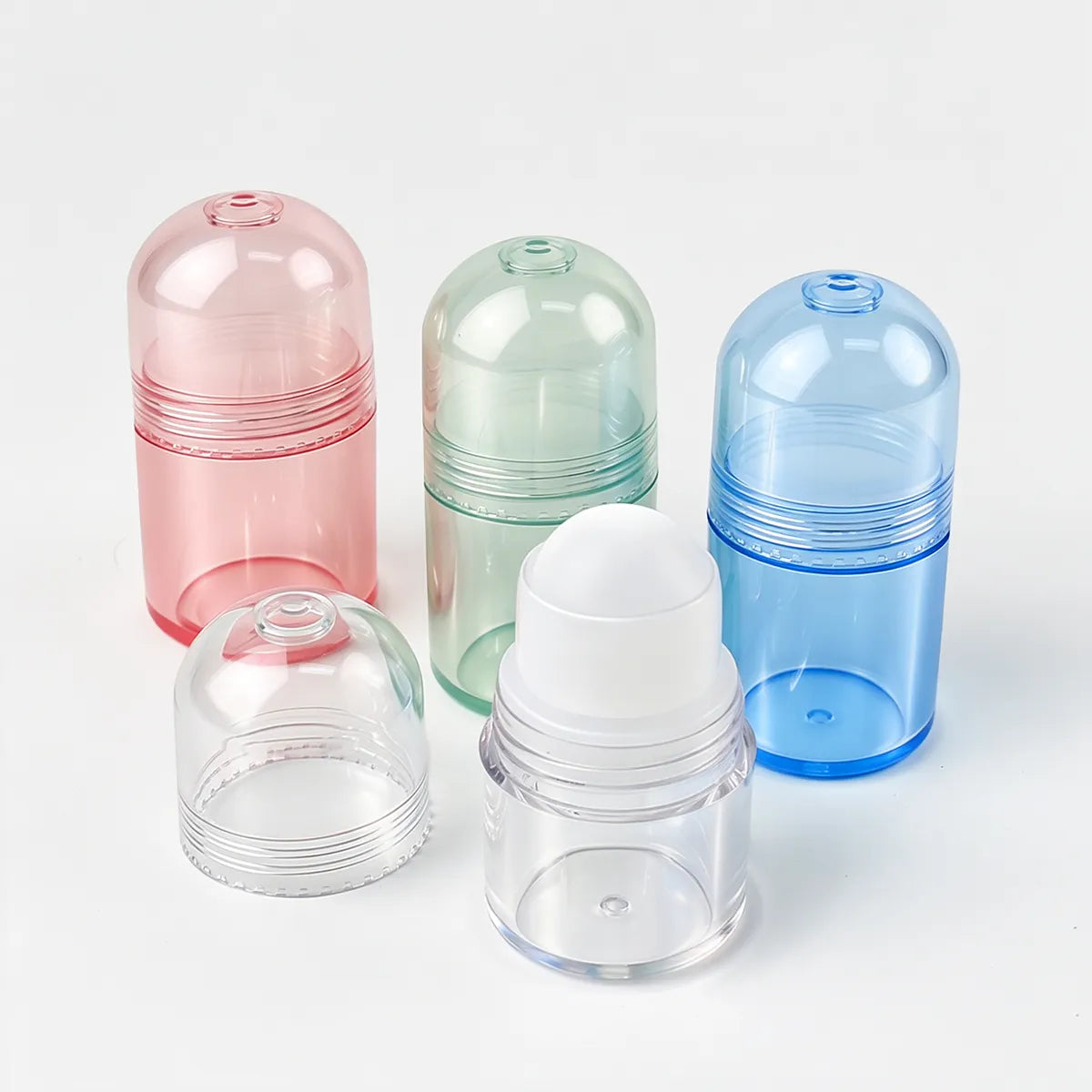 KAIYA plastic makeup bottles in pink, green, blue, and clear color options for roll-on, shimmer, body glow, or liquid makeup products