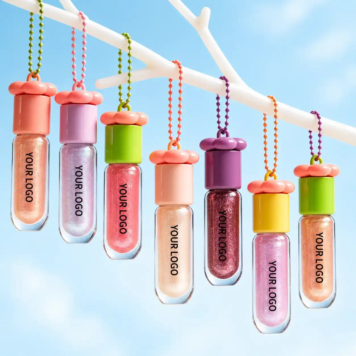 Private label lip plumper assortment in clear charm bottles with colorful caps, YOUR LOGO labels and pearlescent shades.
