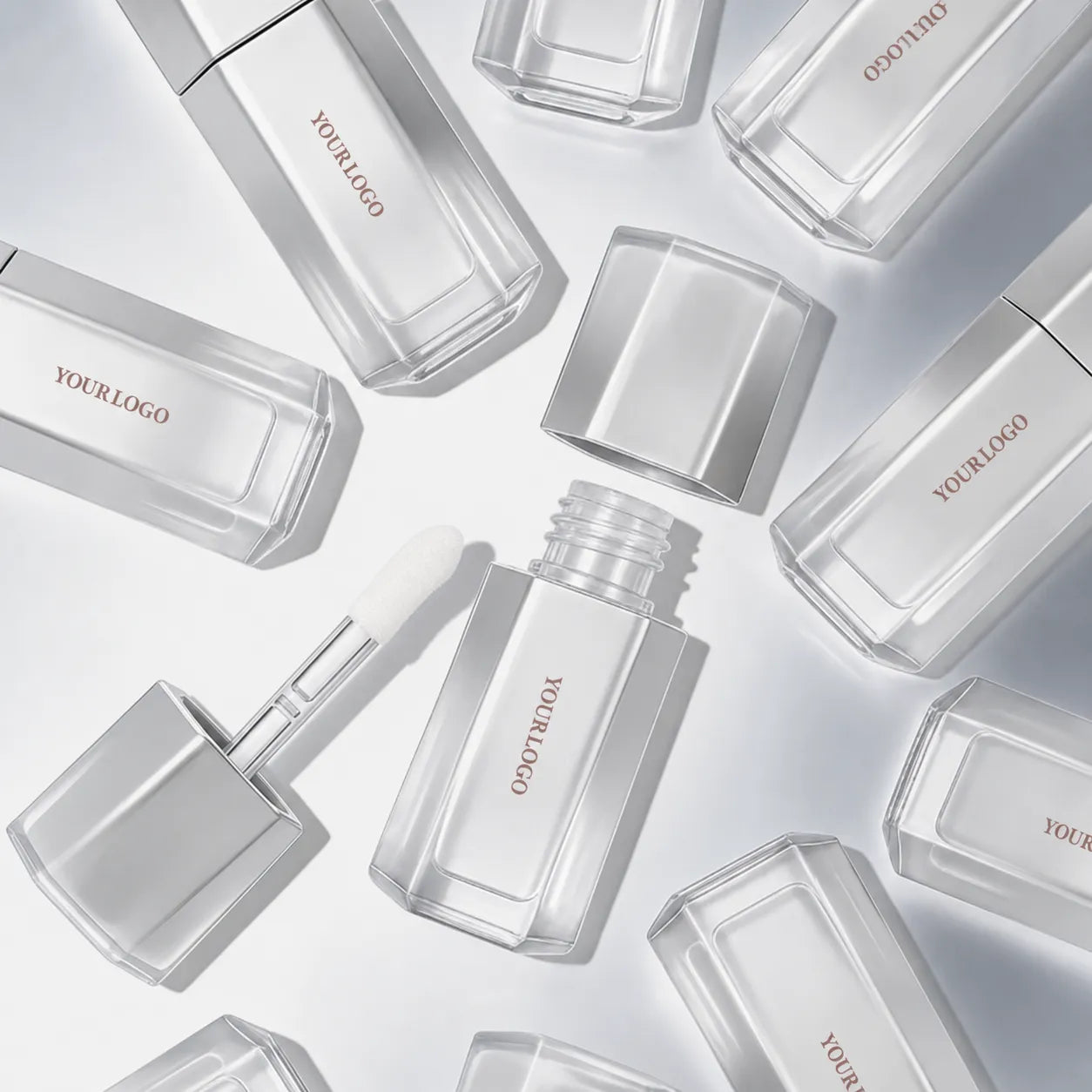 Kaiya silver lip gloss tubes with clear bottle design and custom logo options for lip gloss packaging.