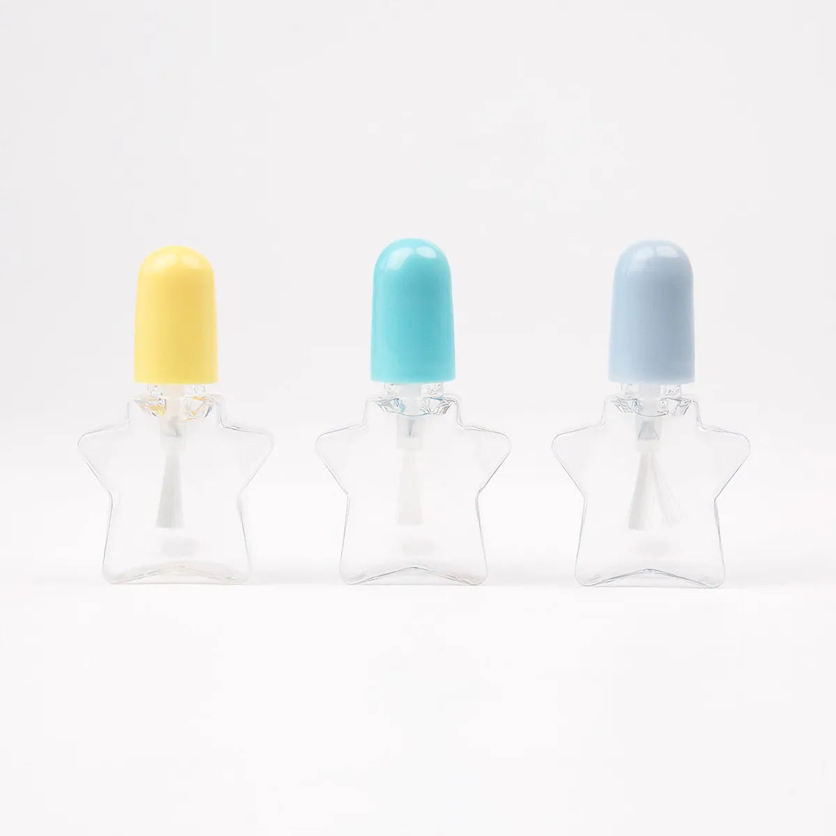 Kaiya star shaped nail polish bottle in a mini clear design with pastel caps