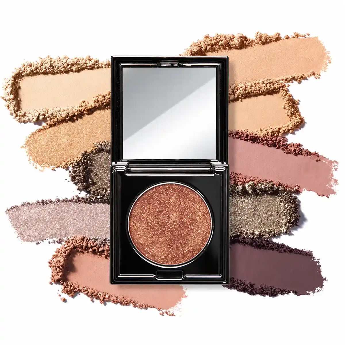 KAIYA single bronze shimmer eyeshadow in an open black mirrored compact, surrounded by pressed-powder color swatches.