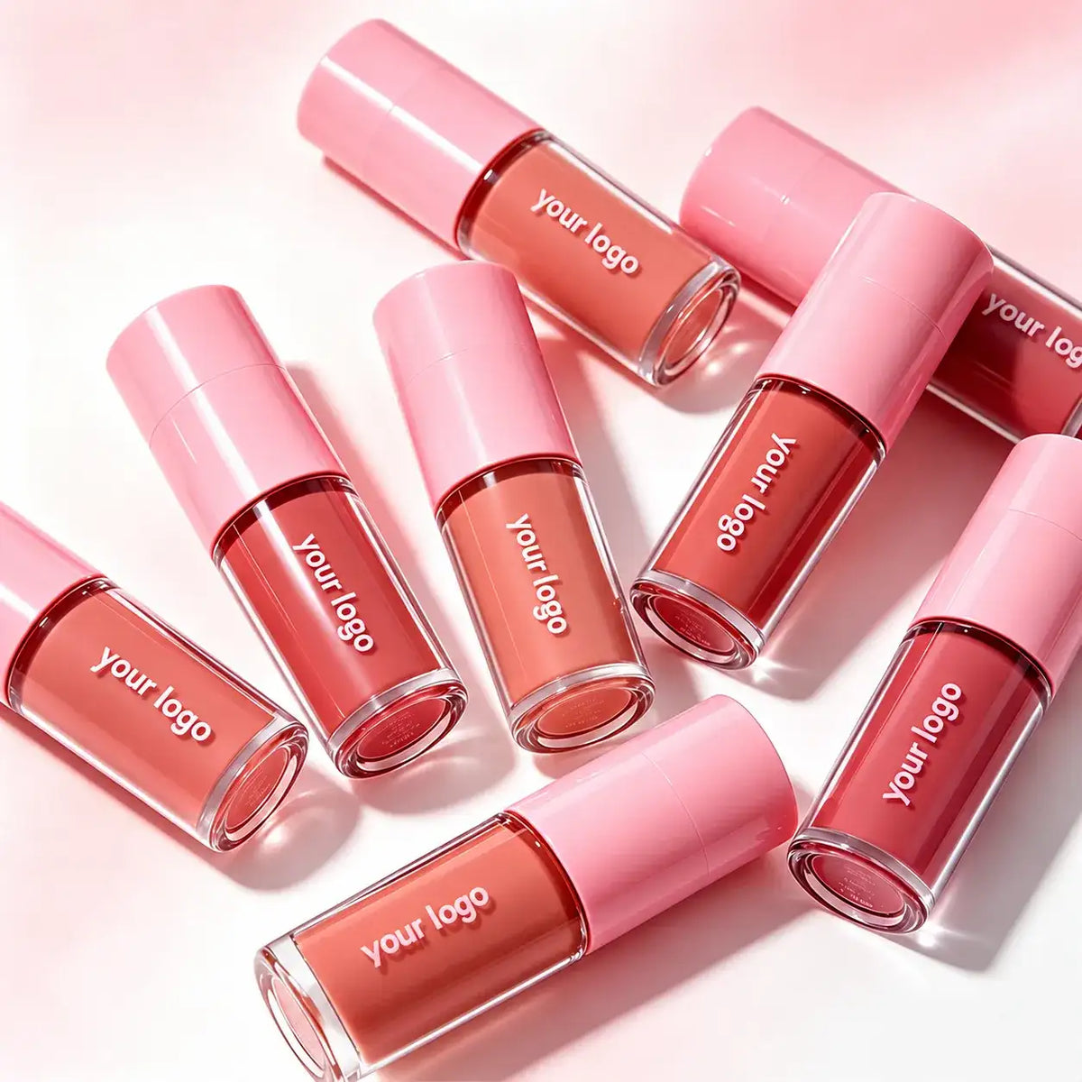 KAIYA wholesale liquid eyeshadow assortment in clear tubes with pink caps, rose-toned shades and custom-logo areas.