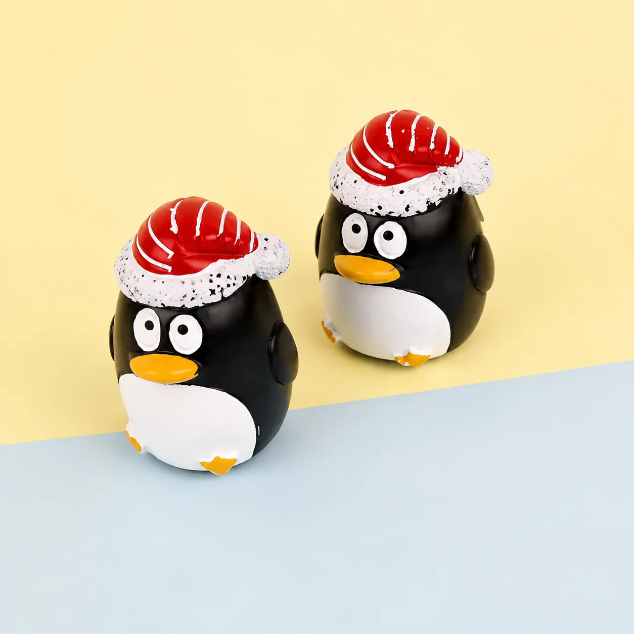 Kaiya kids cosmetic packaging with cute lip balm containers in penguin-shaped designs and playful holiday styling.