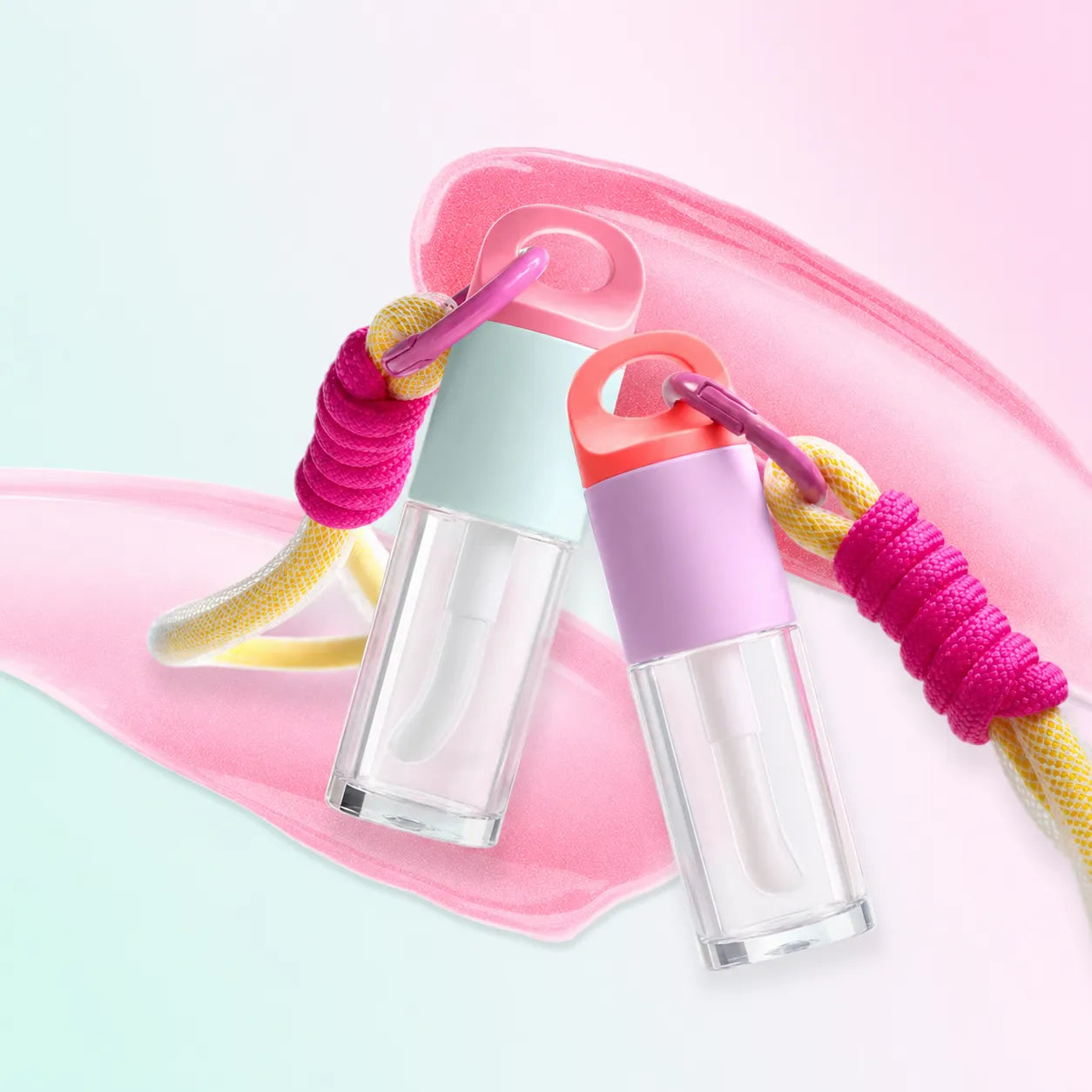 Kaiya kids makeup packaging with cute empty lip gloss containers, transparent lower bodies, pastel caps, and colorful lanyard details.