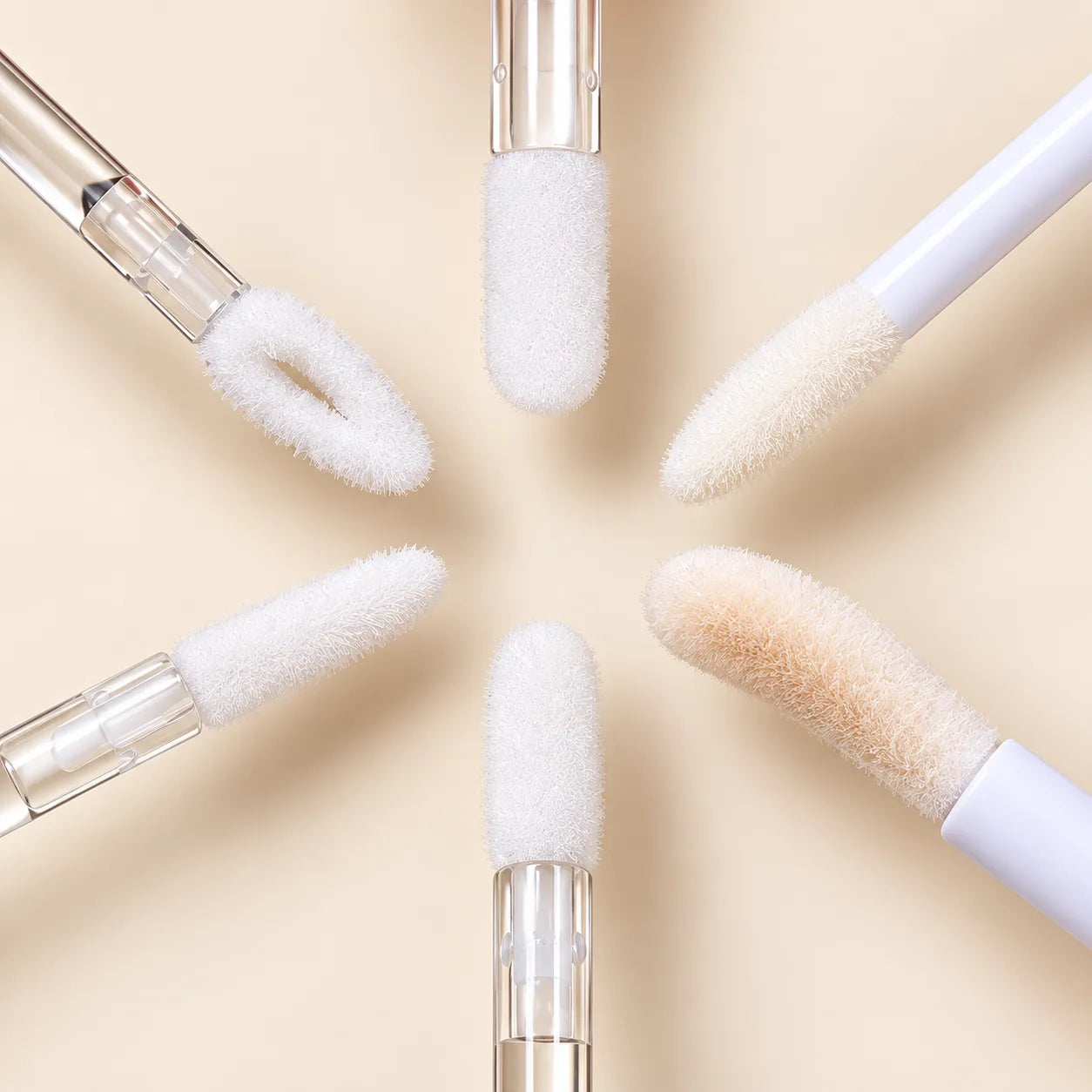 Lip gloss applicator options with different flocked brush shapes for lip gloss bottles