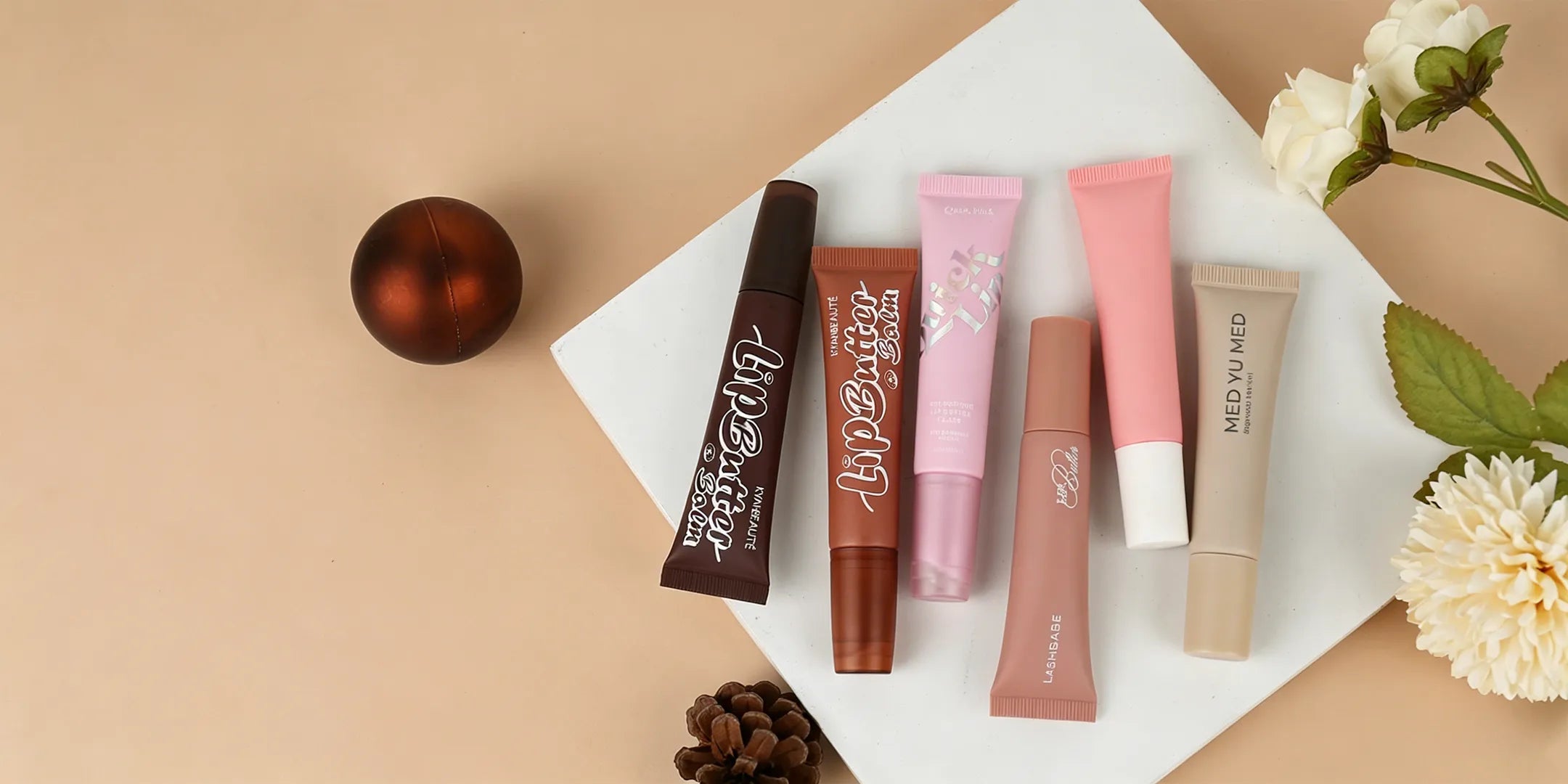Kaiya lip gloss squeeze tube packaging with soft color caps and custom tube options.