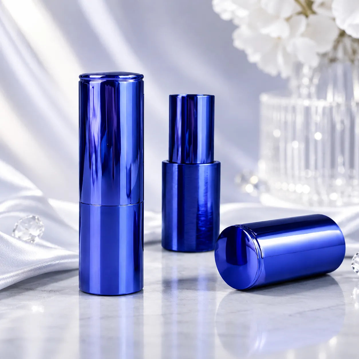 Aluminum empty lipstick containers in glossy blue metal finish with cap and inner lipstick tube structure