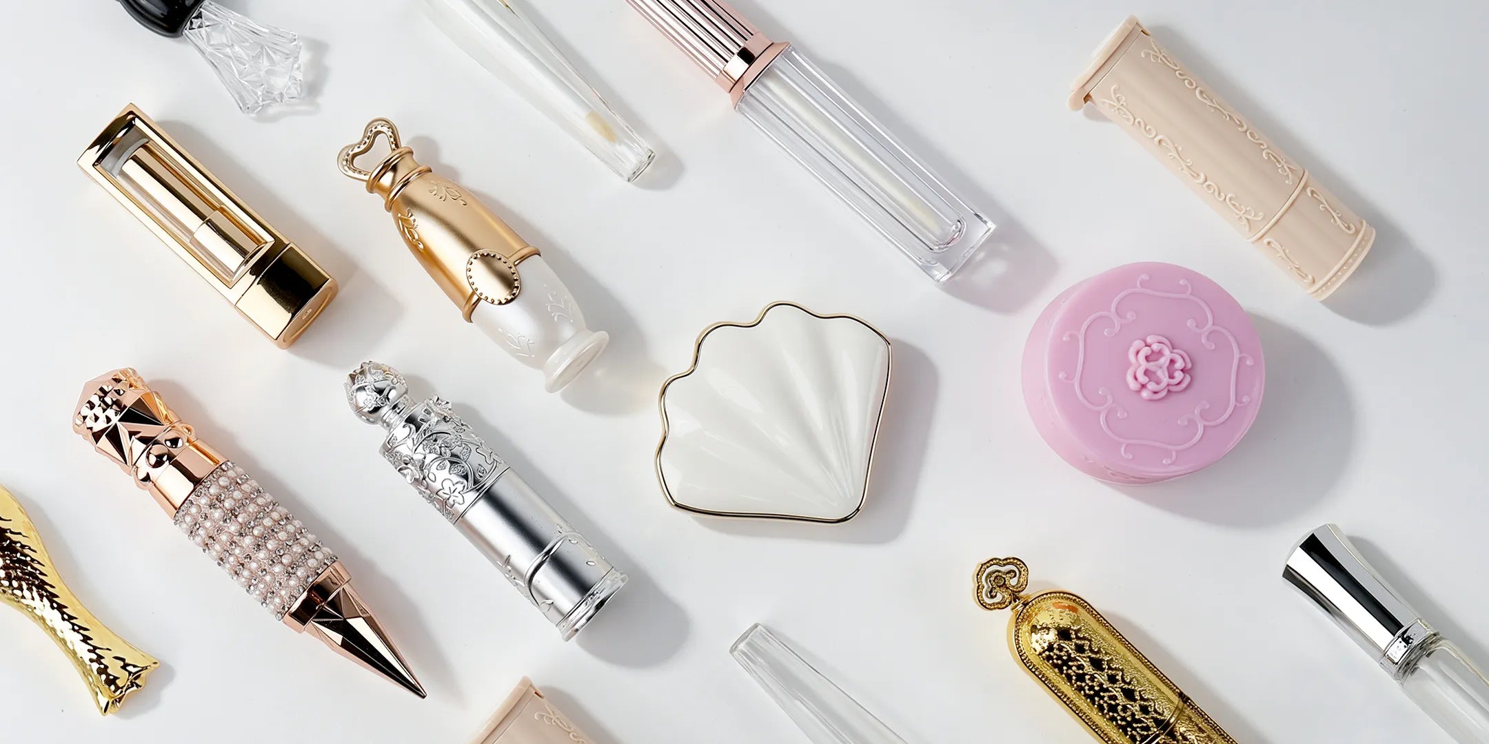 Cosmetic containers wholesale collection featuring lip gloss tubes, lipstick packaging, jars, and custom makeup container designs.