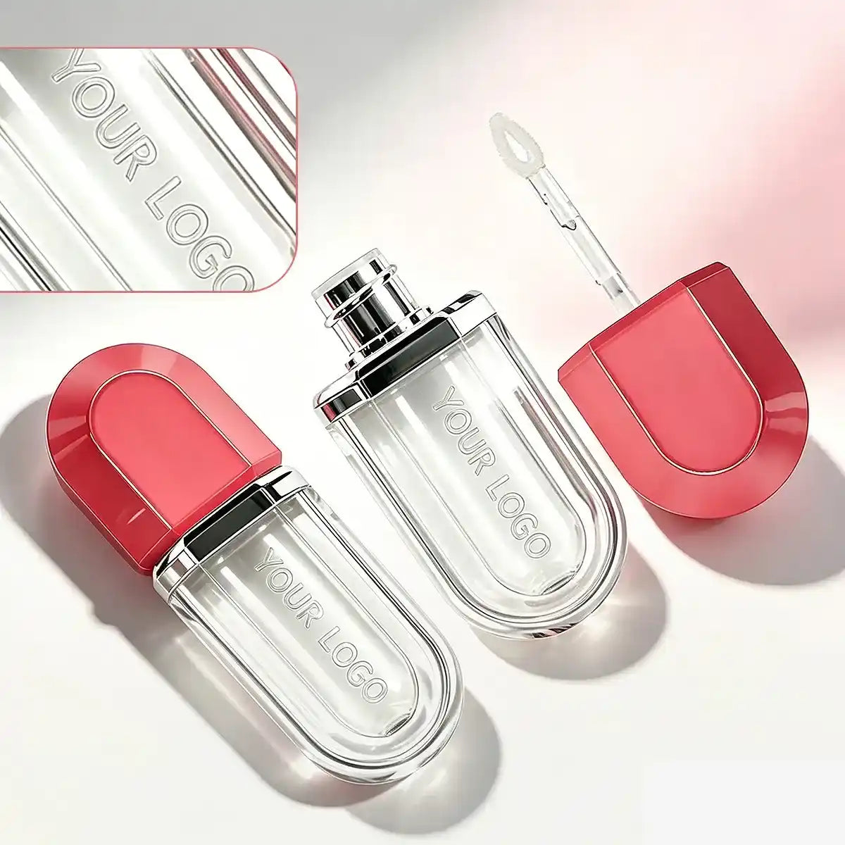 Custom lip gloss tubes with laser engraving detail, clear bottle body, red cap design, and empty applicator packaging.