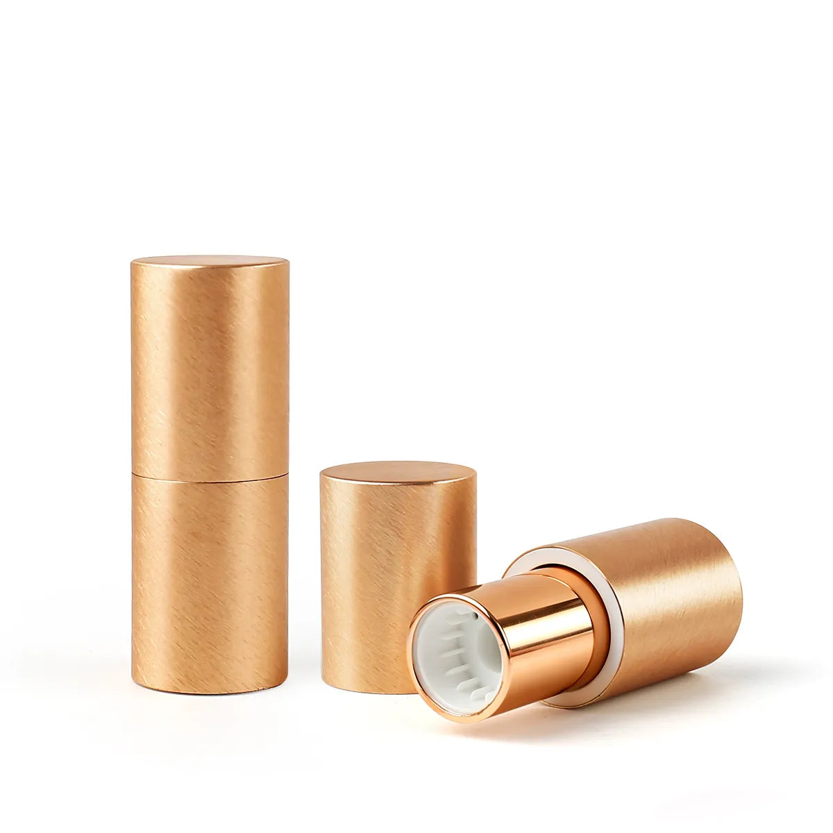 Magnetic refillable foundation stick container in a gold tube design with replaceable inner cartridge for Kaiya empty stick packaging.