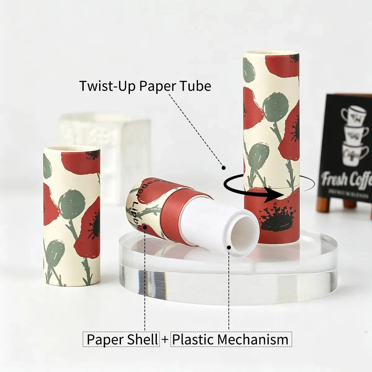Twist-up cardboard lip balm tubes with a printed paper shell and internal plastic mechanism for custom lip balm packaging projects.