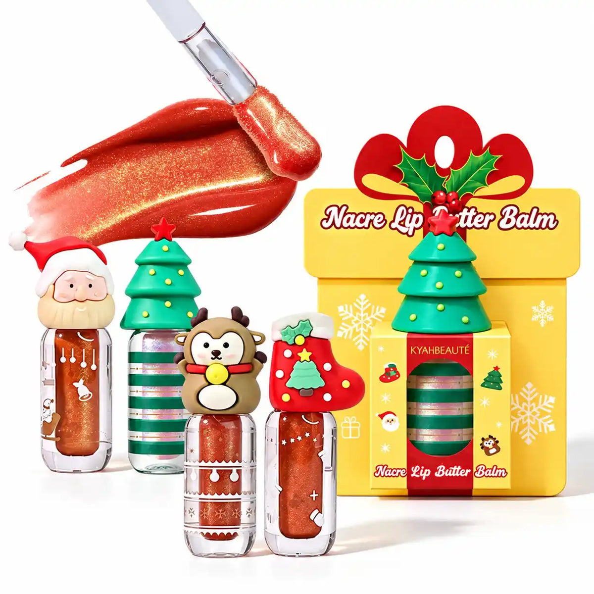 Christmas shimmer lip gloss with a red-gold swatch, applicator and character-cap bottles beside a yellow gift box.