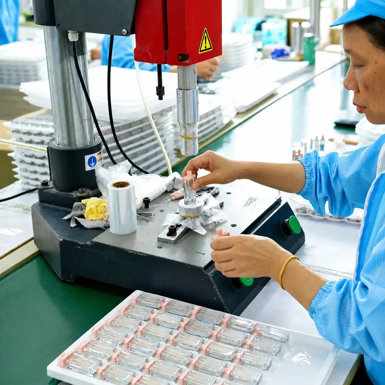 KAIYA cosmetic packaging factory in China with workers assembling and processing color cosmetic packaging components