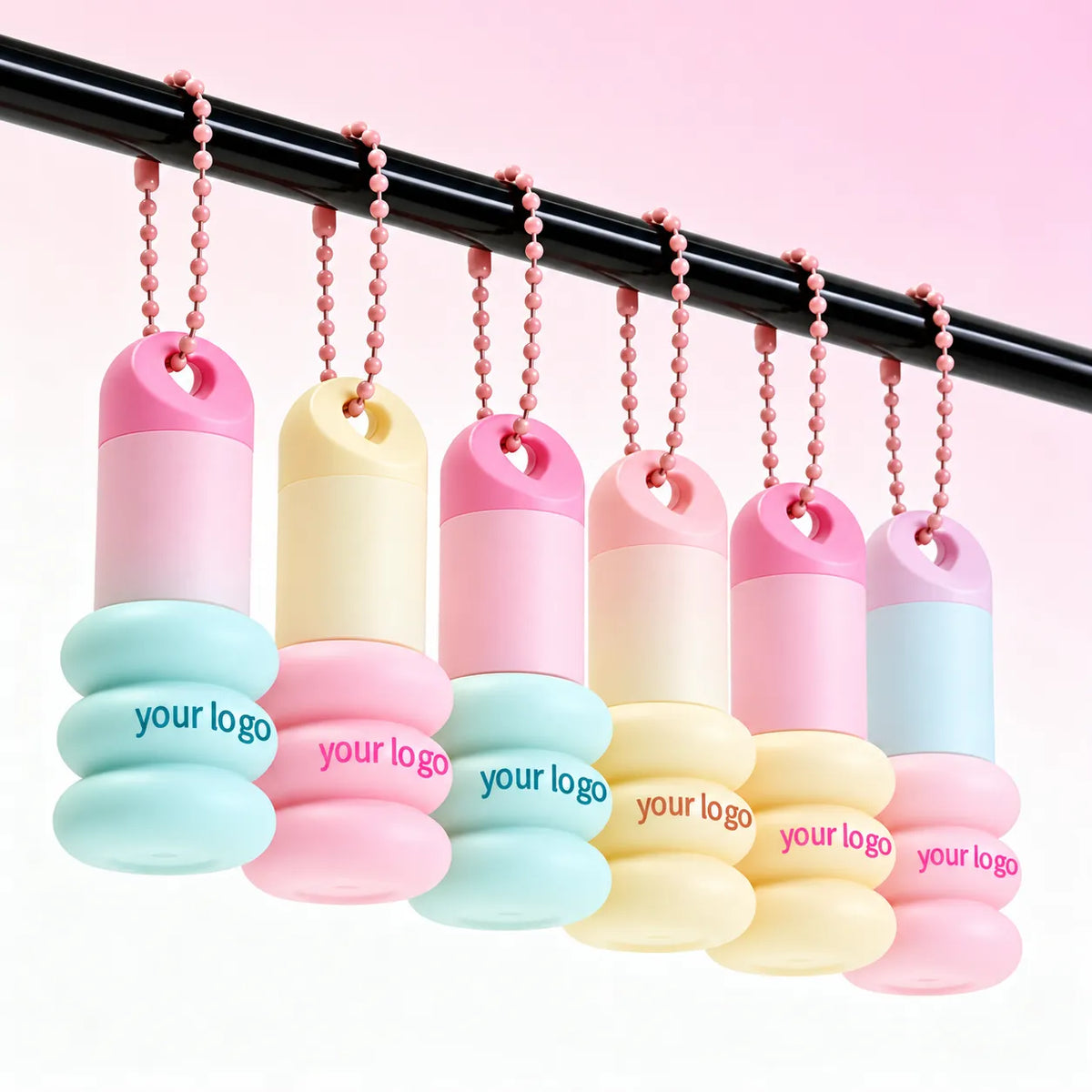 Creative lip gloss tubes with keychain attachments for portable cosmetic packaging concepts, Kaiya