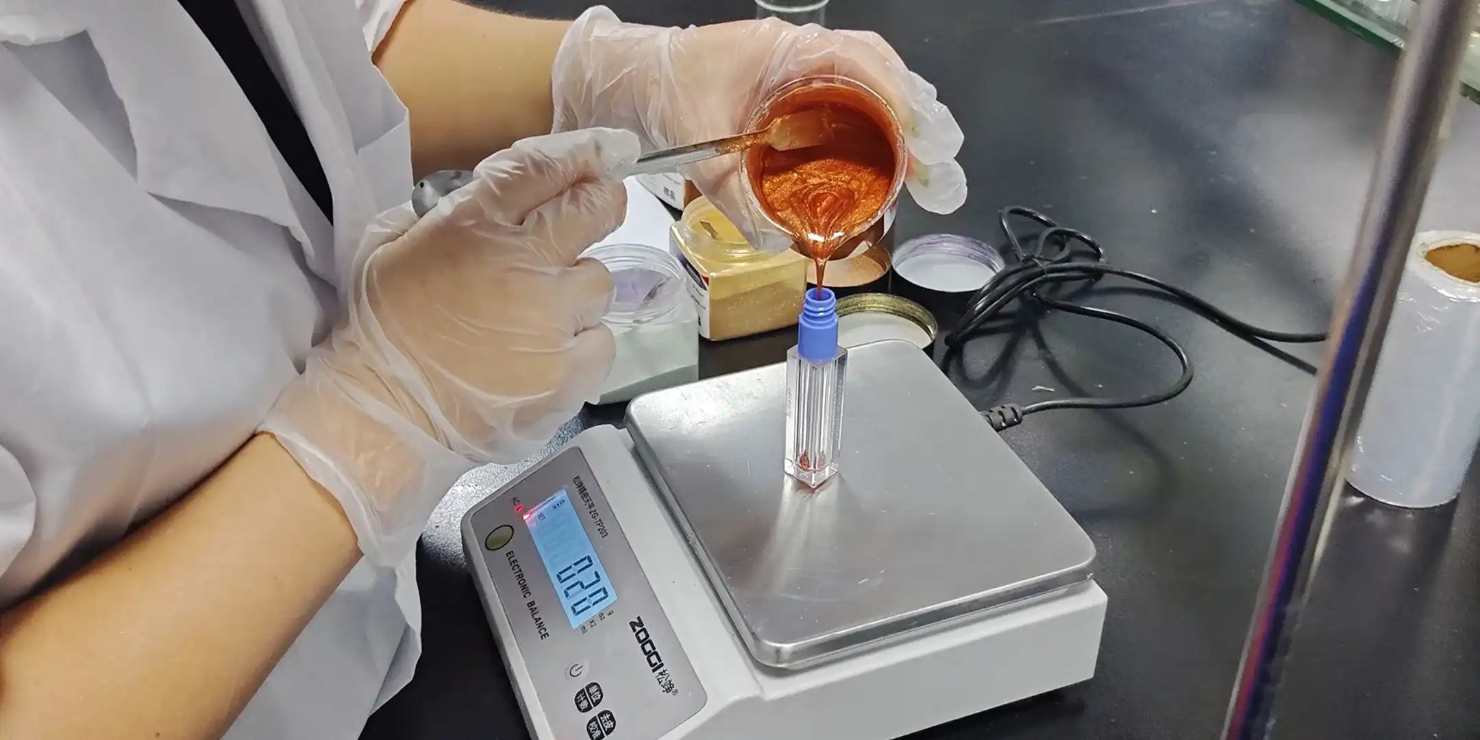 Custom formulation cosmetics sample filling test by KAIYA, showing makeup formula texture review and packaging compatibility check during product development.