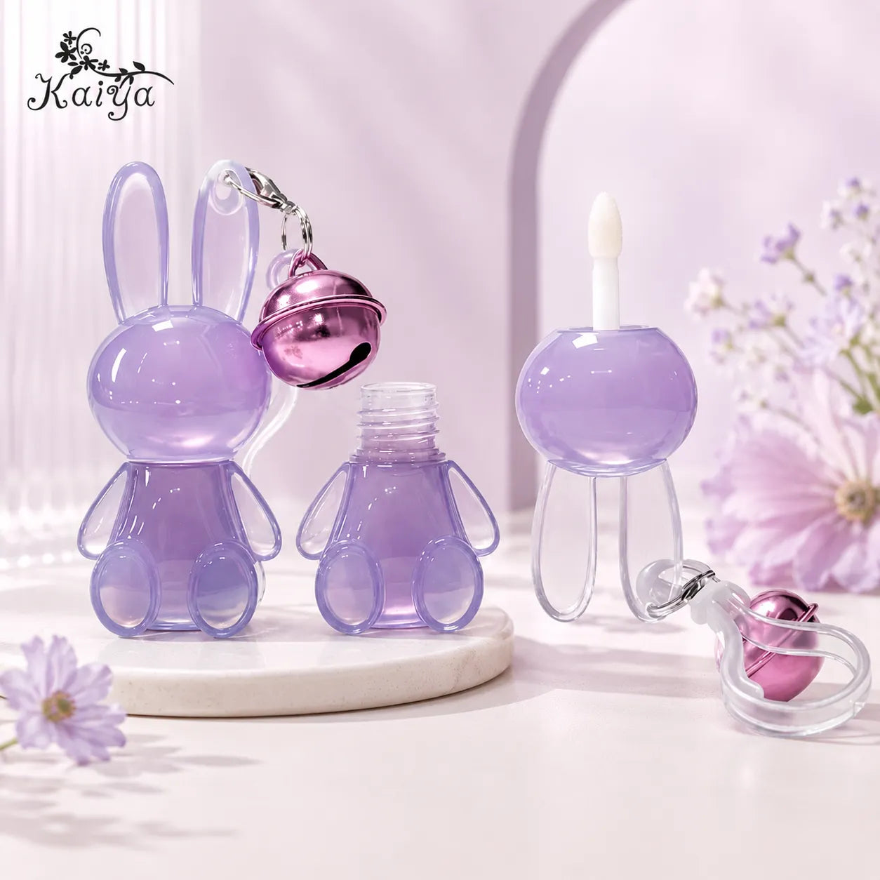 Kaiya custom lip gloss packaging with cute lip gloss containers in a bunny shape and decorative keychain design.