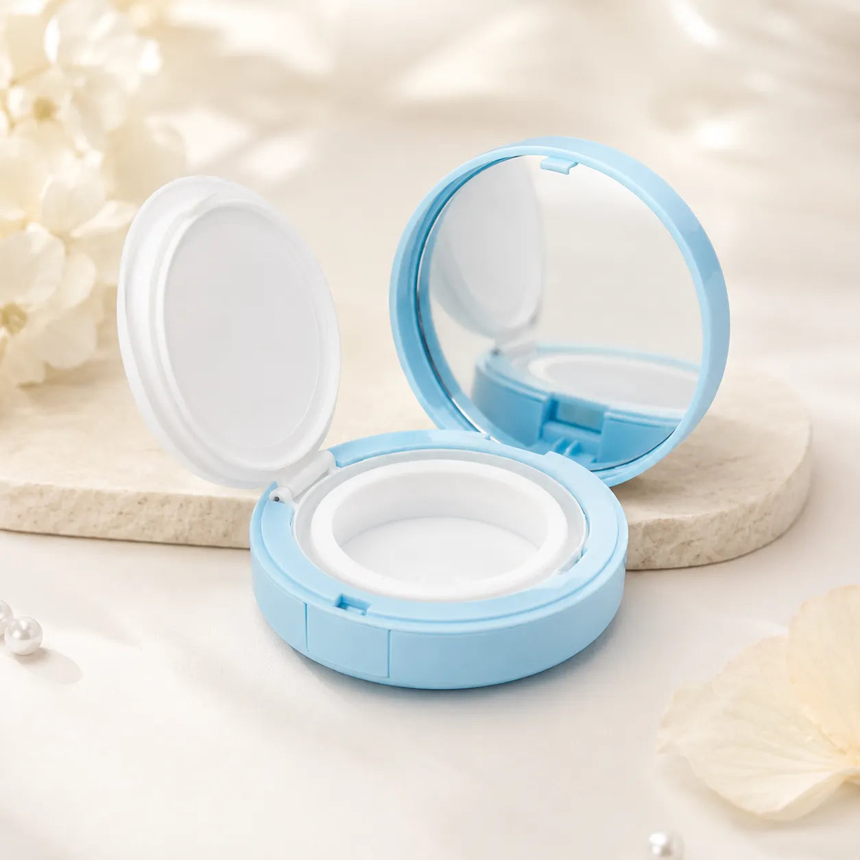 Kaiya empty air cushion compact in a blue open case with mirror, inner lid, and cushion cup for foundation packaging.