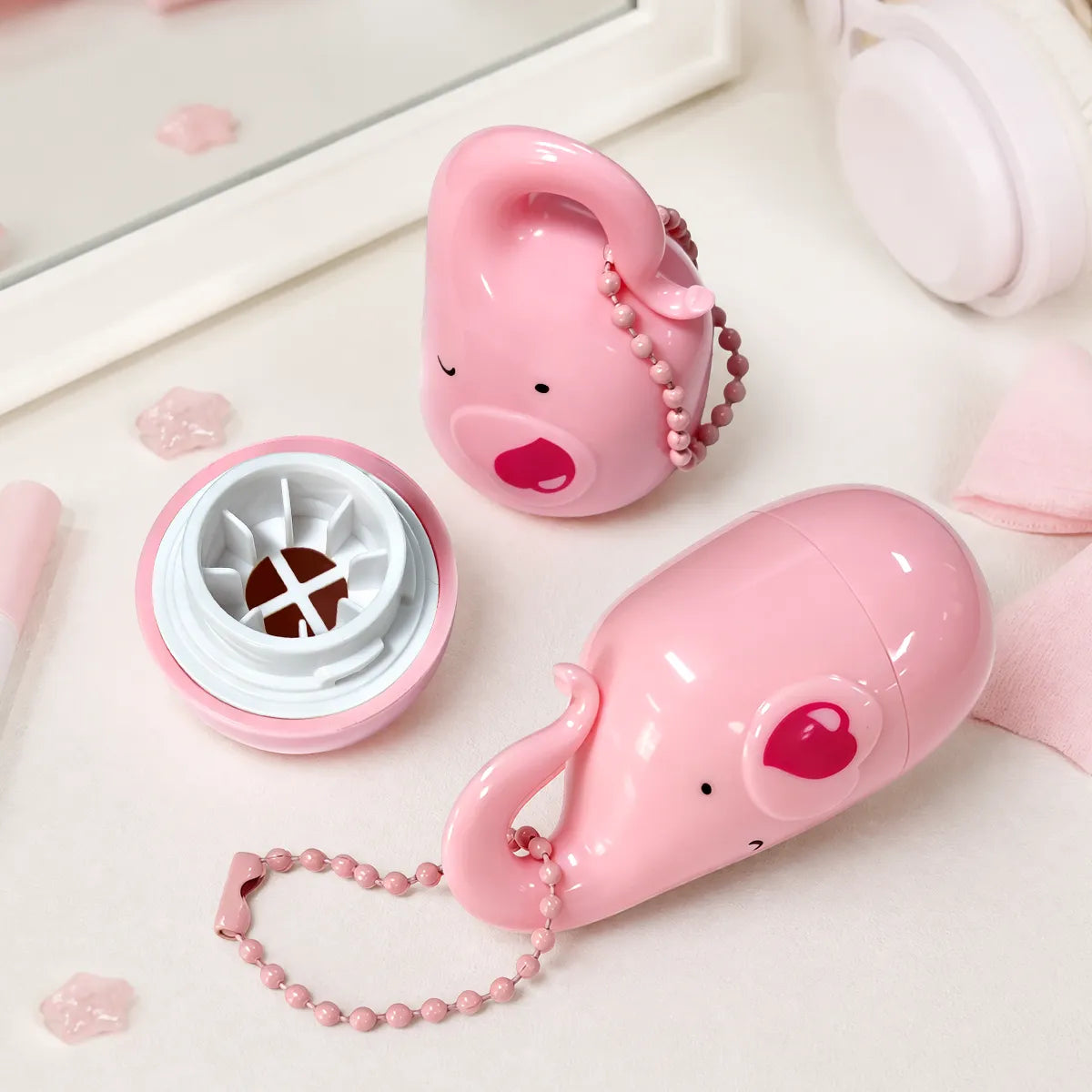 Cute pink empty blush container with decorative chain and custom cosmetic packaging design