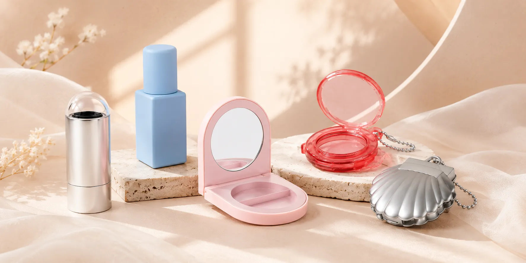 Kaiya empty blush container wholesale collection featuring a silver stick case, pastel compact, shell compact, and mini blush packaging.