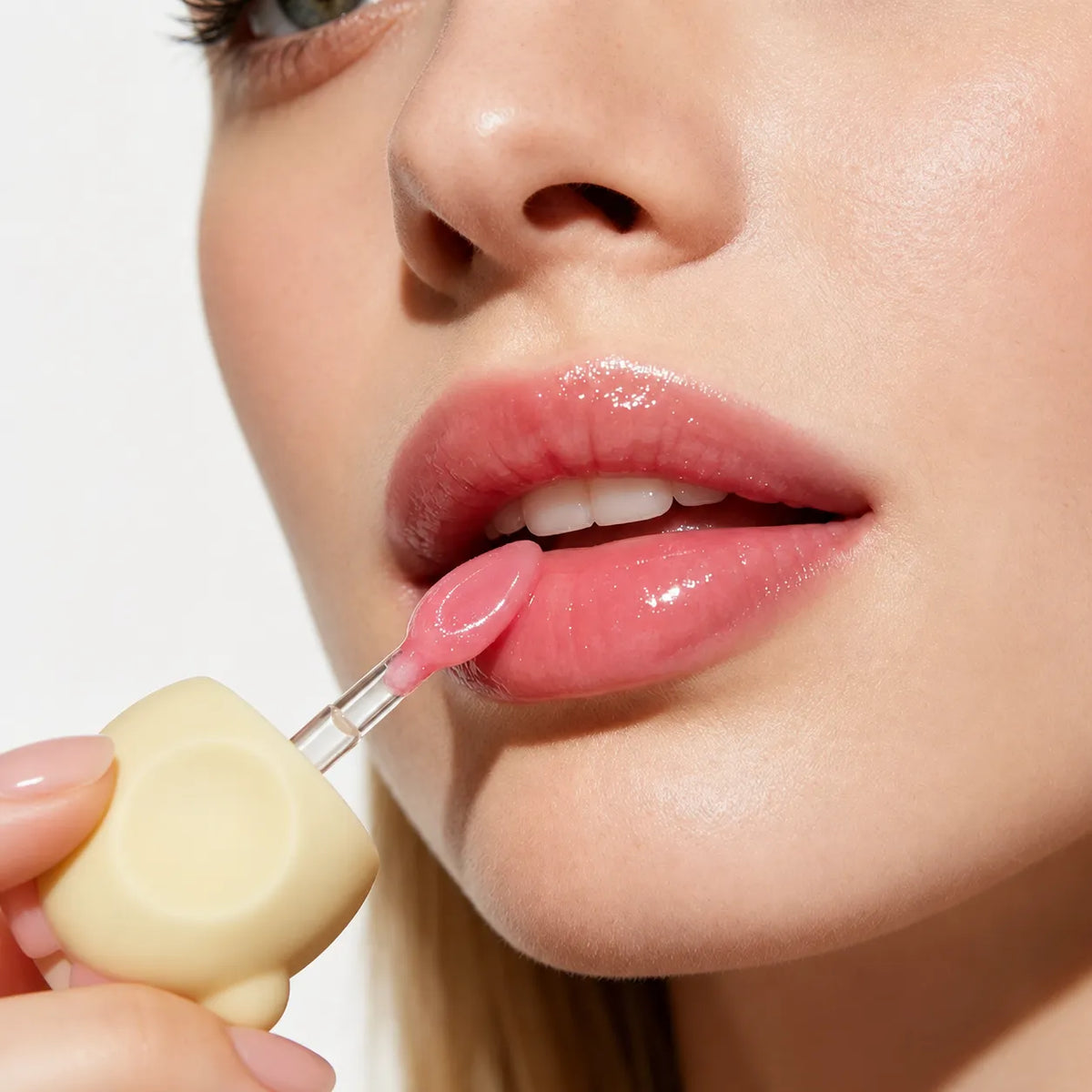 Glossy liquid lipstick applied with a wand for a smooth high-shine finish