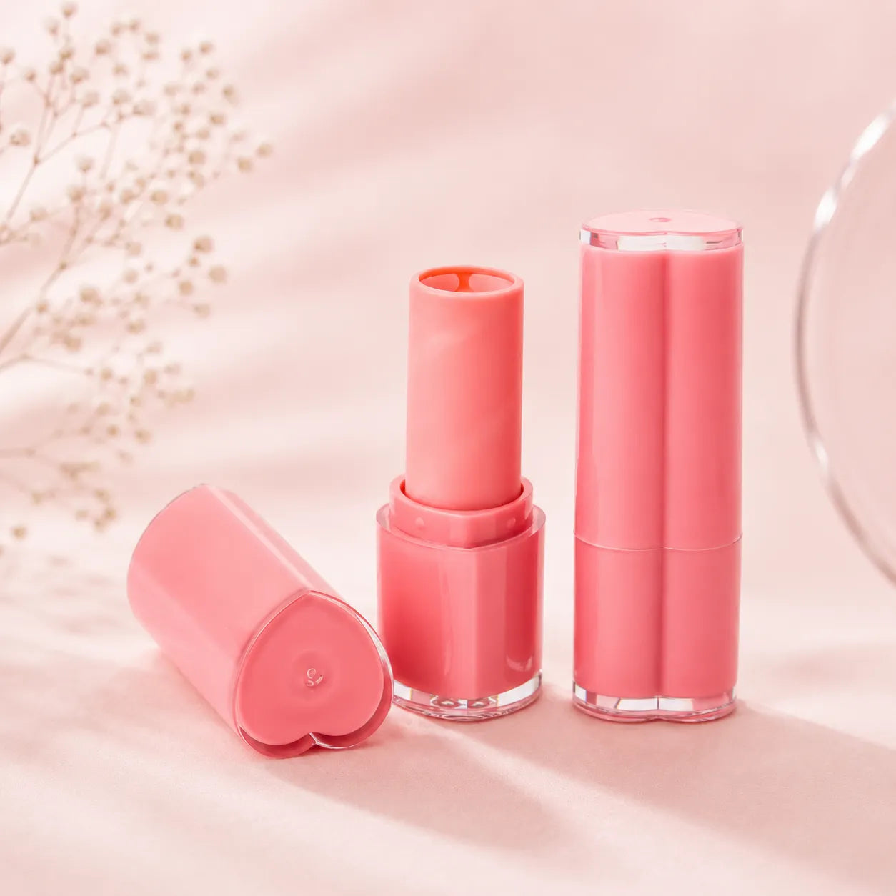 Kaiya heart-shaped lip balm containers with pink tube design for custom lip care packaging projects
