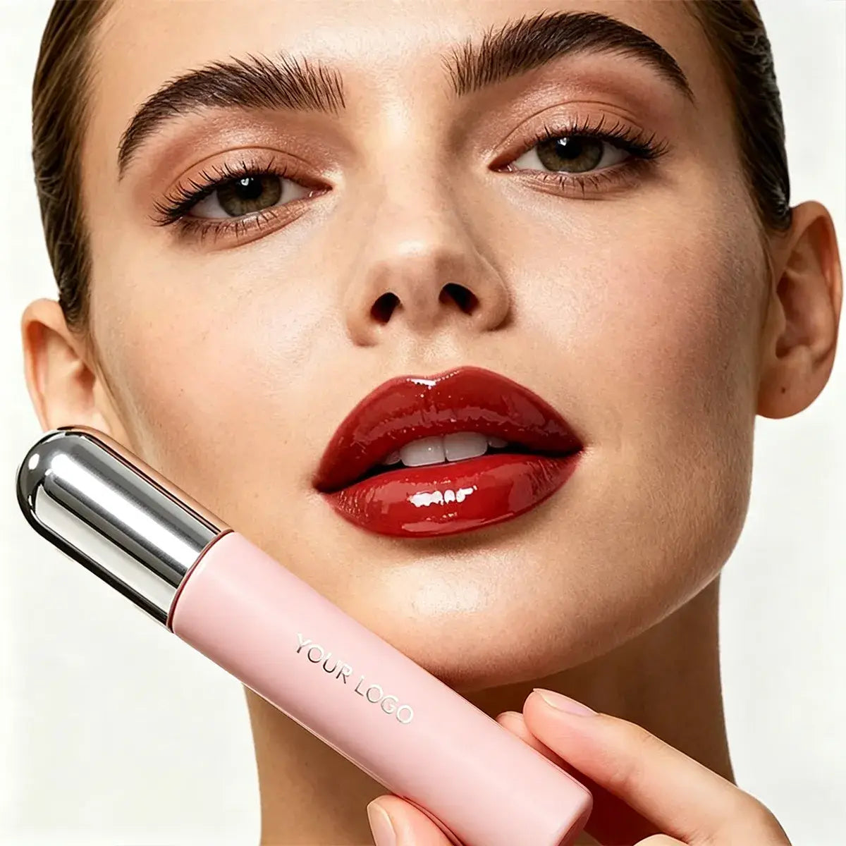 Model wearing rich red high-shine lip gloss with saturated color and a reflective finish.