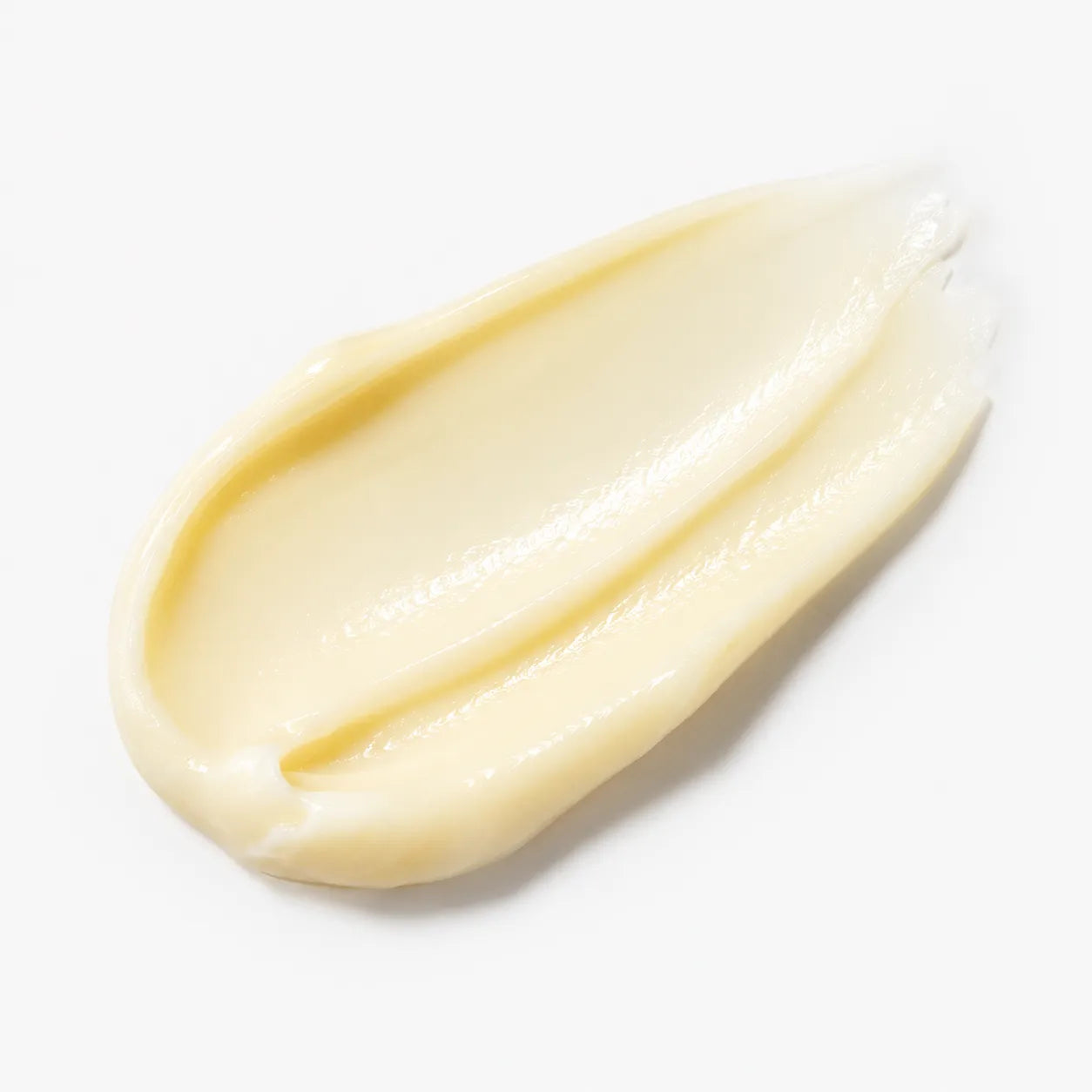 Creamy lip balm formulation swatch showing the soft, smooth texture assessed for climate and package fit.