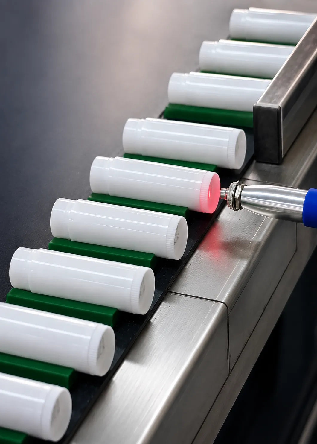 KAIYA lip balm manufacturer using automated production line equipment to inspect lip balm tubes during factory manufacturing