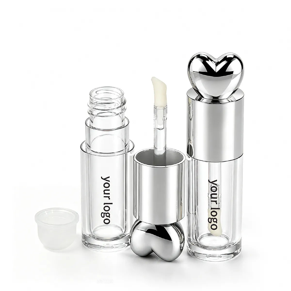 Clear liquid highlighter tube containers with silver heart-shaped caps, a wand applicator and a separate wiper insert.