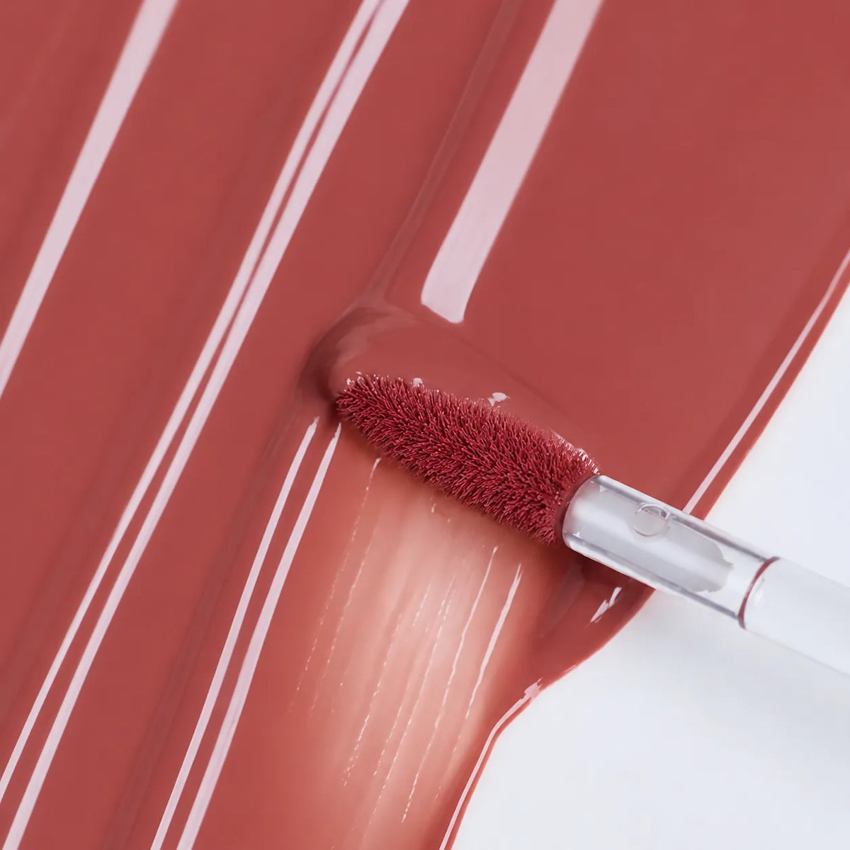 Liquid lipstick applicator showing formula pickup, smooth spread and coat consistency