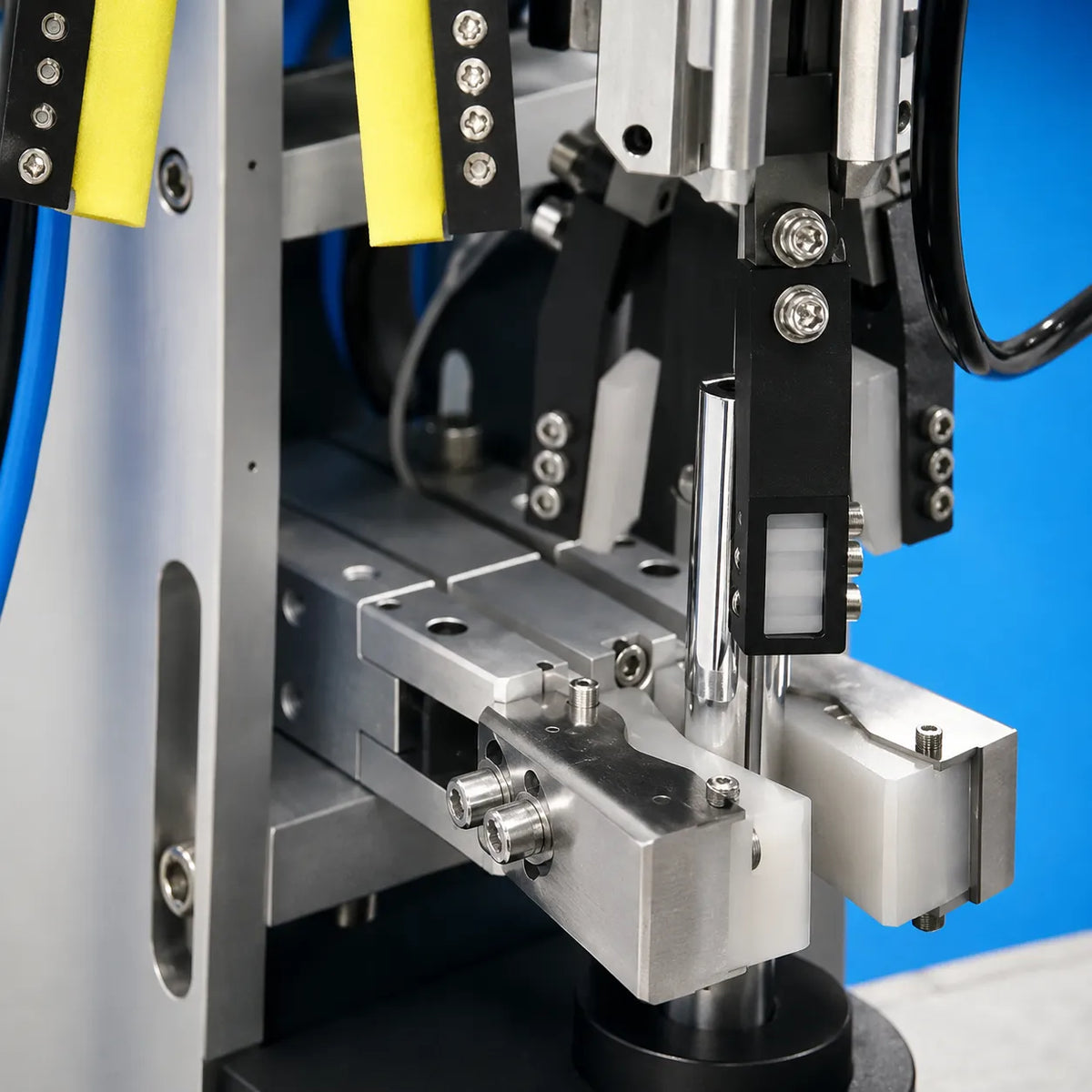 Automated equipment handling liquid lipstick components during the manufacturing process