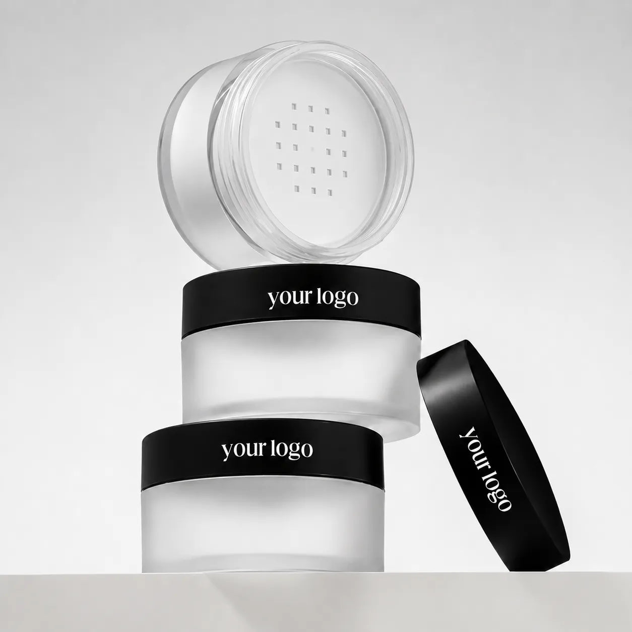 Kaiya empty loose powder jar with sifter in frosted transparent packaging with black lids
